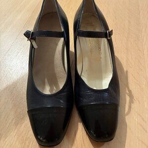 Navy blue leather pumps.